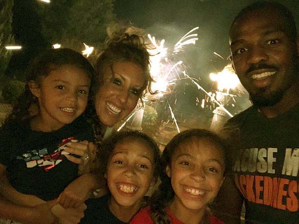 Photo of Jon Jones and his wife and daughters.